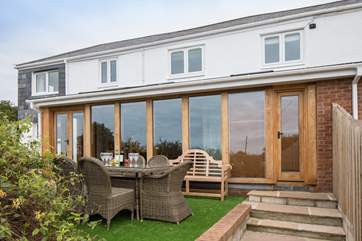 The fabulous glass front to this house offers the most spectacular views from the beautiful open plan living areas.