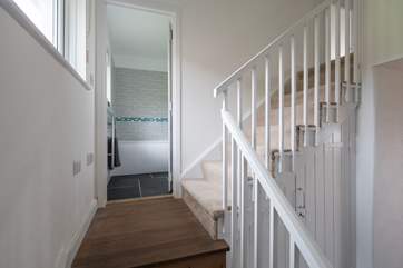 The stairs lead off up to the first floor.