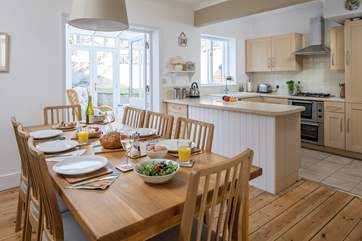The dining-area has plenty of space to seat eight people at the table.