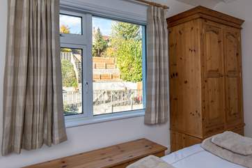 Bedroom 2 has views out over the terraced garden.