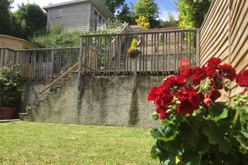 The terraced garden has lawn at the bottom and then two flat levels, please supervise children on the steep steps.