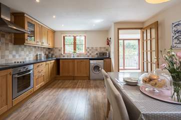 The spacious and well-equipped kitchen/diner is perfect for whipping up a feast.