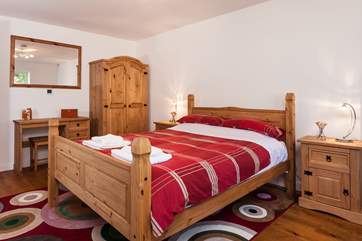 Bedroom 2 is located on the ground floor too, and has an adjoining en suite bathroom.