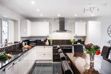 The lovely open living-room with kitchen and dining areas.