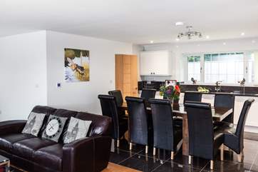 The open plan living-room with kitchen and dining areas is the perfect spot to socialise and catch up on family news.