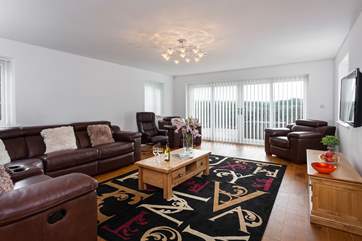 The seprate cosy sitting-room has doors leading out onto the front patio.