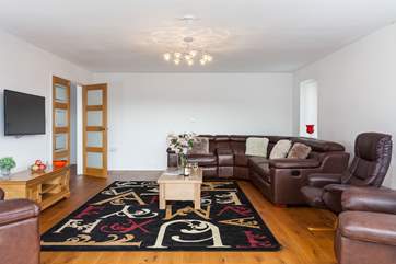 The sitting-room has plenty of room for the whole family.
