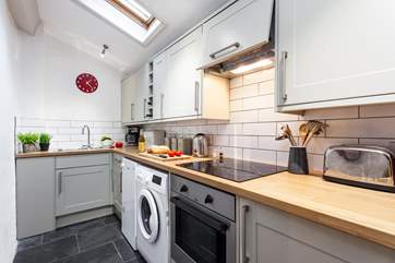 The super little galley kitchen is fully equipped.