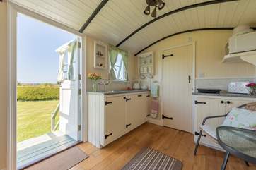 There is even a small kitchen area, including a single induction hob and all-important kettle.