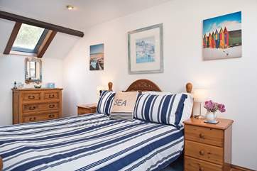 This is the double bedroom, with plenty of light and a cheerful seaside theme.