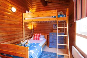 Any child will love the charm and sense of adventure in this twin bedroom.