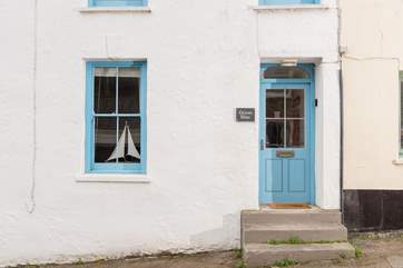 You will find holiday bliss through the blue front door.