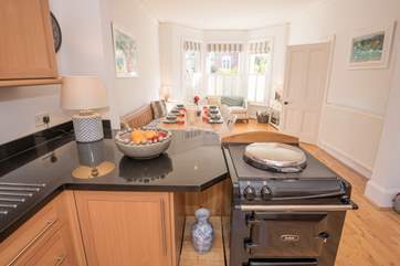 There are doors from the kitchen that lead out to the enclosed decked area