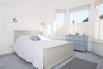 The double bedroom is fresh and full of light