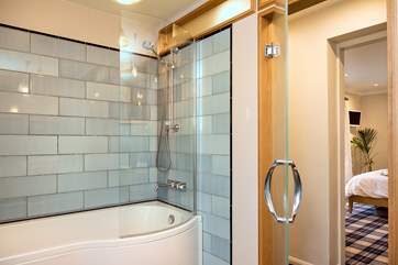 There is a dressing area between the en suite and bathroom, keeping the mess out of sight.