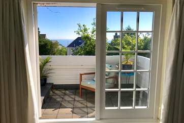 The master bedroom has a fabulous balcony with views to the sea.