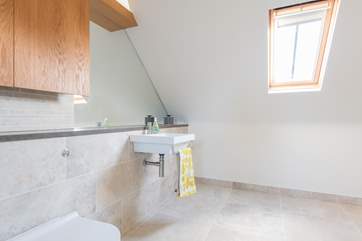 The first floor bathroom with shower cubicle leads into bedroom four