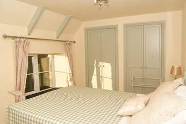 This is the second double bedroom. This lovely bright room also looks out to the front of The Cottage and over the orchard.