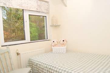 There is a dear little single bedroom overlooking the garden. Though the room is small, the view is large - all the way down the valley.