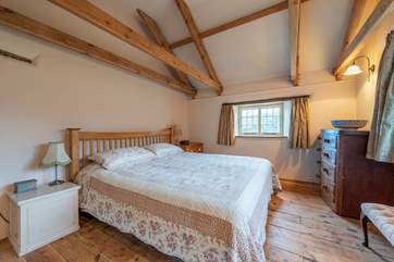 The master bedroom has original oak beams.