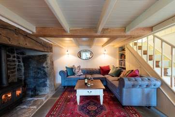 Stairs lead up from the sitting-room.