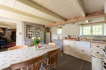 Head through the kitchen to the sitting-room.