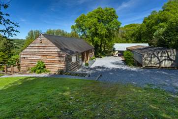 Larch Barn faces south and so gets the sun on the terrace all day long, the barn opposite is used for storage.