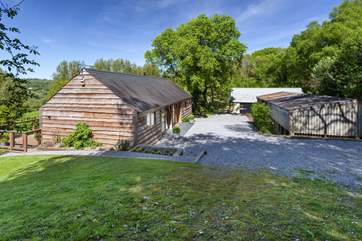 Larch Barn faces south and so gets the sun on the terrace all day long, the barn opposite is used for storage.