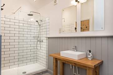 The stylish en suite not only has a large shower...