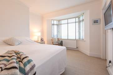 The master bedroom with lovely views over The Green is located to the front of the property, has its own walk-in wardrobe and...