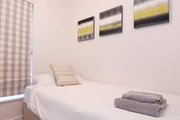 The single bedroom is next door to the twin room.