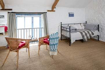 The sleeping quarters offer a day bed for those who wish to enjoy a touch of peace and quiet.