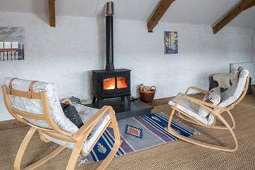 Relaxing back in front of this glowing wood-burner is such a treat after a full day of exploring.