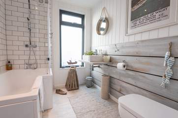 The main bathroom is located on the ground floor, with a bath and fitted shower