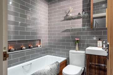 Enjoy a long soak in the family bathroom.