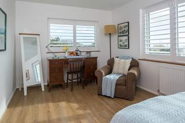 Bedroom 1 is light and airy, offering a great spot to relax with a good book should you need to escape the excitement of the main house.