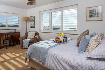 Bedroom 1 is home to a super inviting king-size bed. The dual aspect feature of this room is simply stunning.