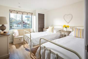The pretty twin bedroom overlooks the entrance to the development.
