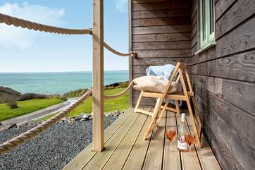The sheltered verandah is the perfect spot for a glass of wine.