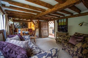 Enter into the cosy living-room which leads to the kitchen and stairs to the first floor.
