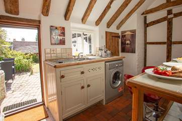 It has a light and airy cottage kitchen.