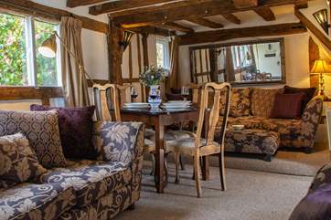 The living-room provides a lovely space for dining.