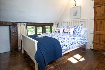 The light streams into this adorable bedroom.