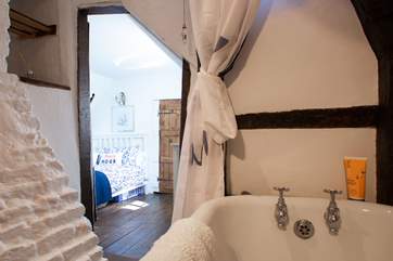 The en suite bathroom has a bath with shower above and is a perfect use of space.
