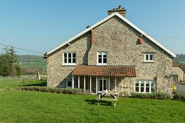 This view of the cottage is taken from its enclosed garden.