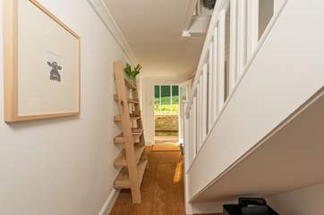 This is the entrance hall. Just outside the front door there is a covered area so that you can take off your boots under shelter.