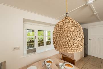 A path runs alongside the kitchen window to the front door.