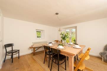 Another view of the dining-room with the French windows to the garden.
