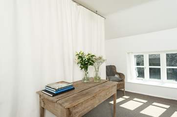 An eclectic mix of rustic and vintage furniture adds to the unique feel here.