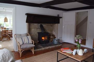 This is another view of the living room to show the fireplace and wood burning stove.